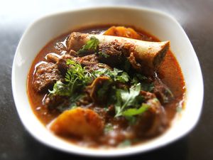 Mangalorean mutton gravy, served in a small bowl.