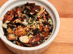 Closeup of a ramekin filled with Soy Glazed Pumpkin Seeds With Furikake
