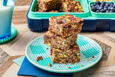 Stack of homemade protein bars on a patterned plate