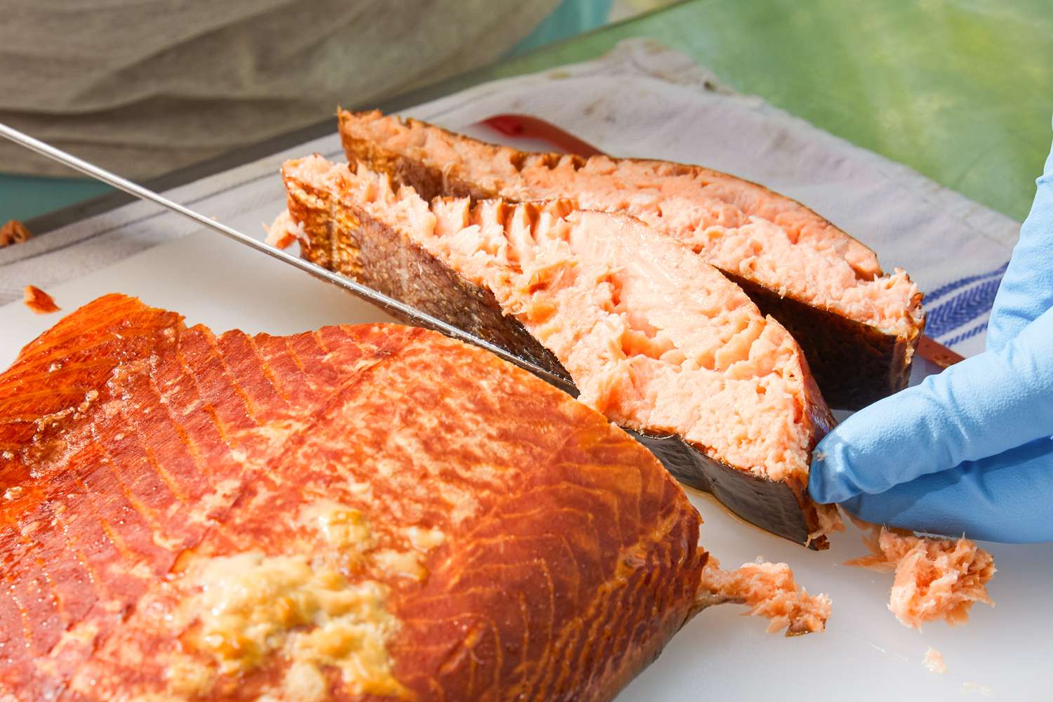 Meat cooked in the Bradley Professional P10 4-Rack Outdoor Electric Smoker (BS1019) is sliced