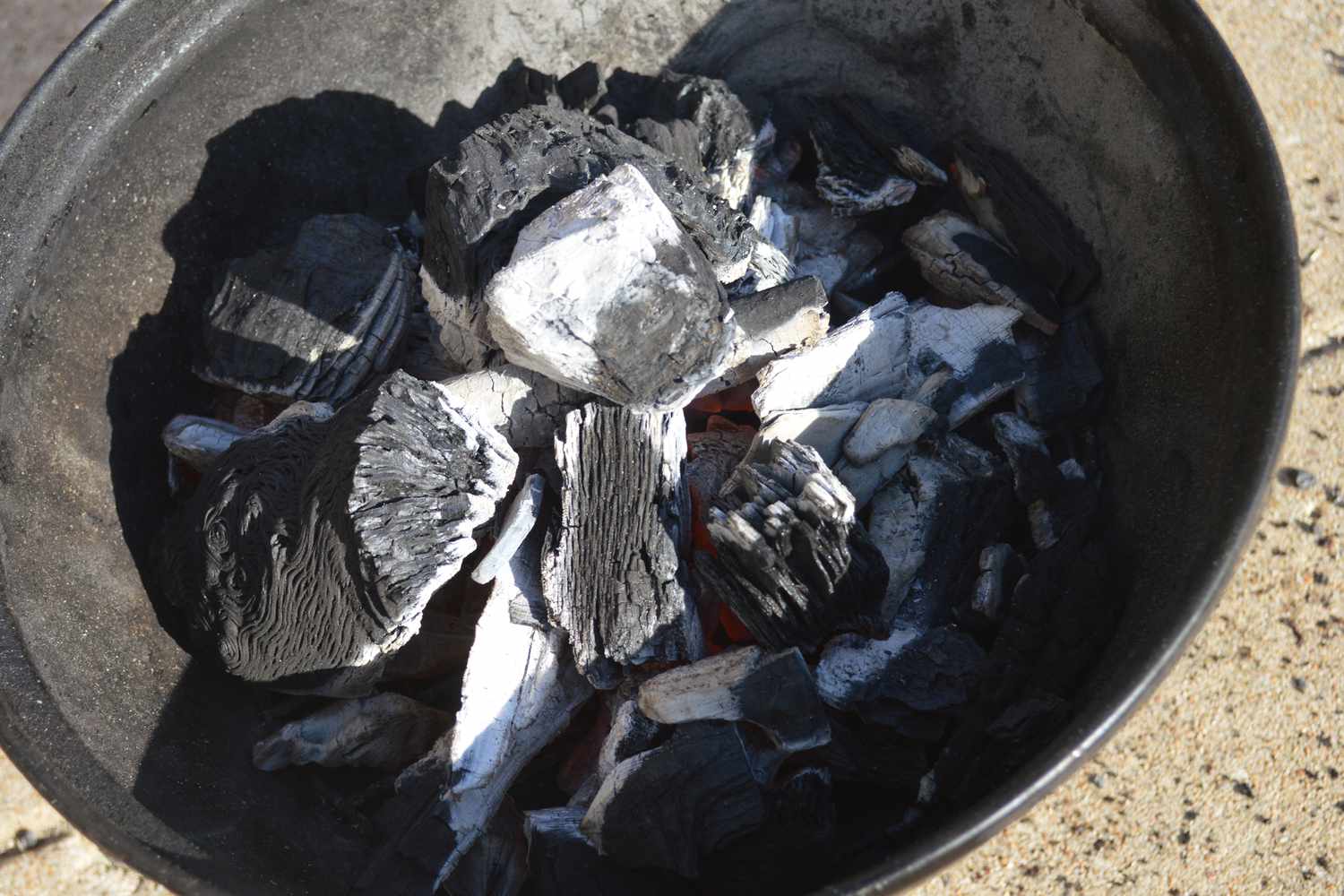 Close-up of Cowboy Hardwood Lump Charcoal in a grill
