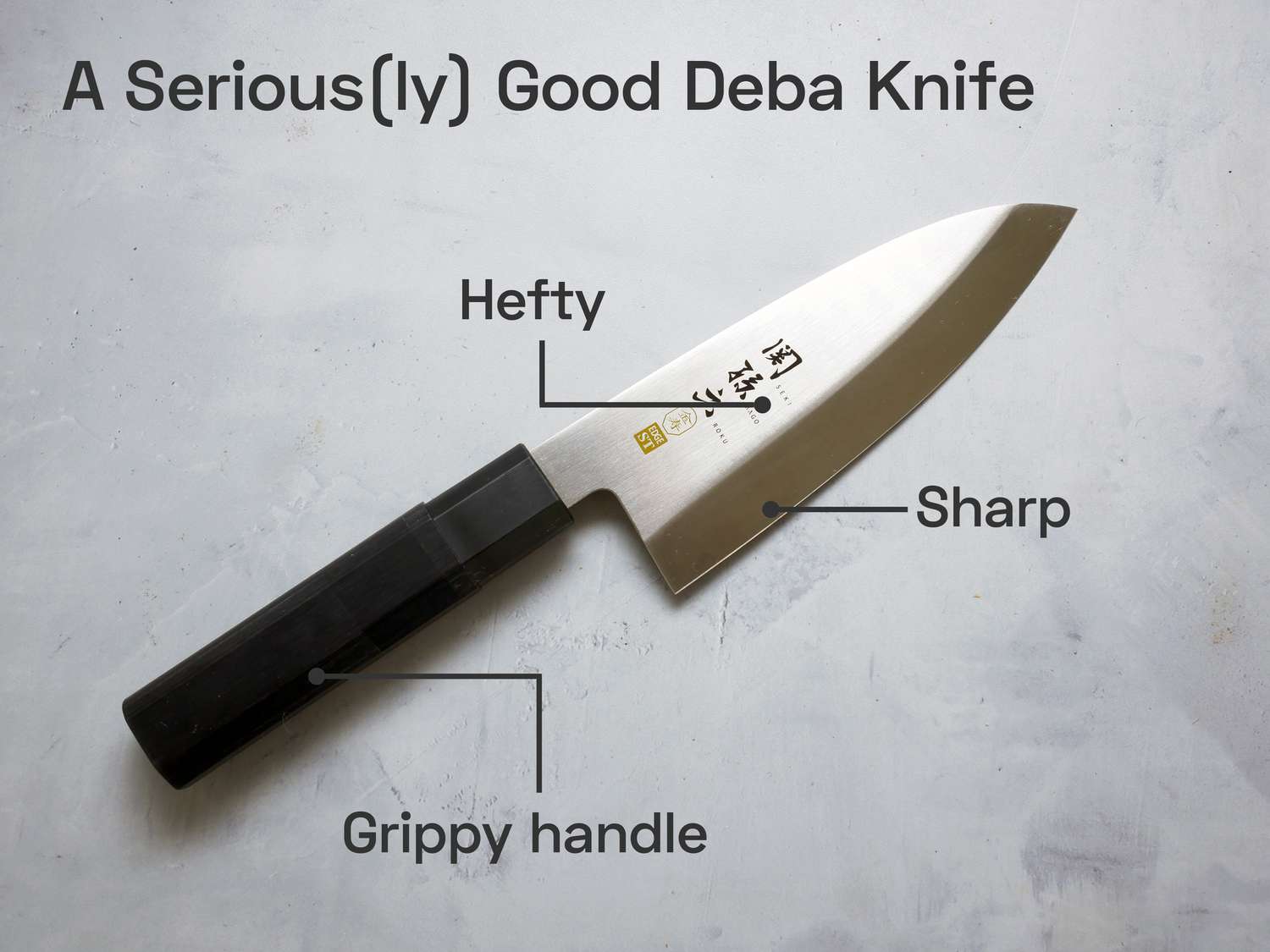 our winning deba knife on a grey background with text overlaying it, saying "A Serious(ly) Good Deba Knife," and "Grippy handle," "Sharp," and "Hefty".
