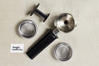 Parts of the Gaggia Classic Pro Espresso Machine on a table