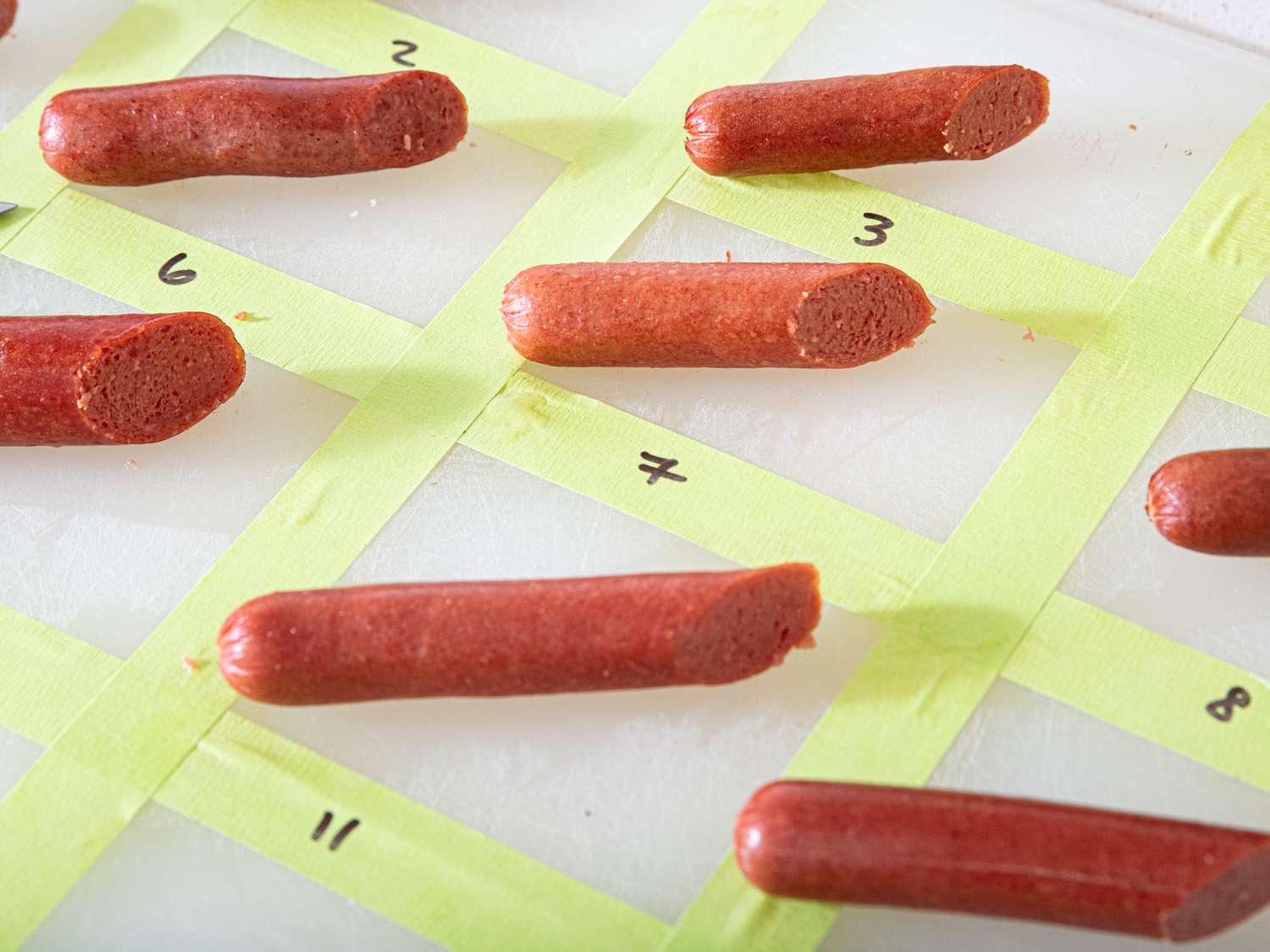 Rows of hot dogs arranged on a grid noted with numbers