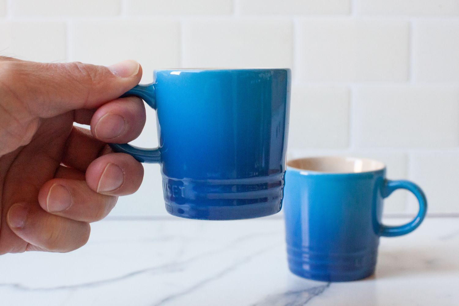 person drinking espresso in Le Creuset Espresso Mugs 