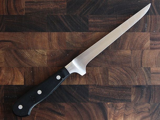 Wüsthof Classic 6-Inch Flexible Boning Knife on wood cutting board