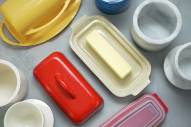 butter dishes and bells on a gray background