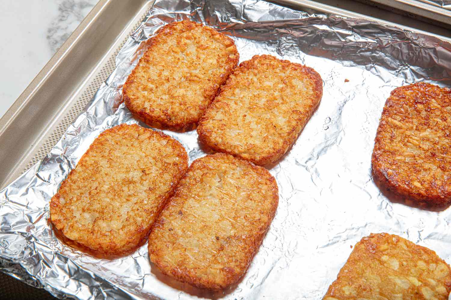 Hash browns on a foillined baking tray
