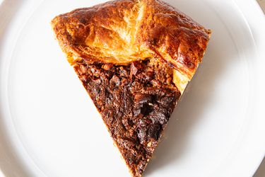 Chocolate pecan galette on a plate.