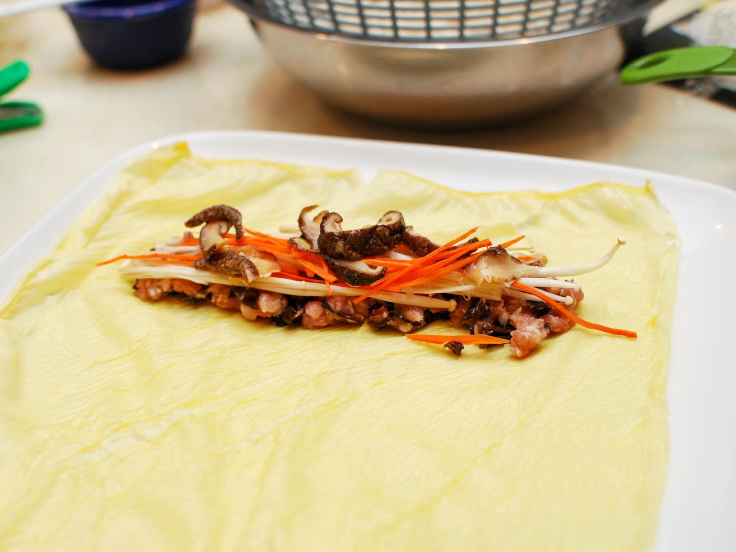 Sliced, marinated shiitake mushrooms are added.