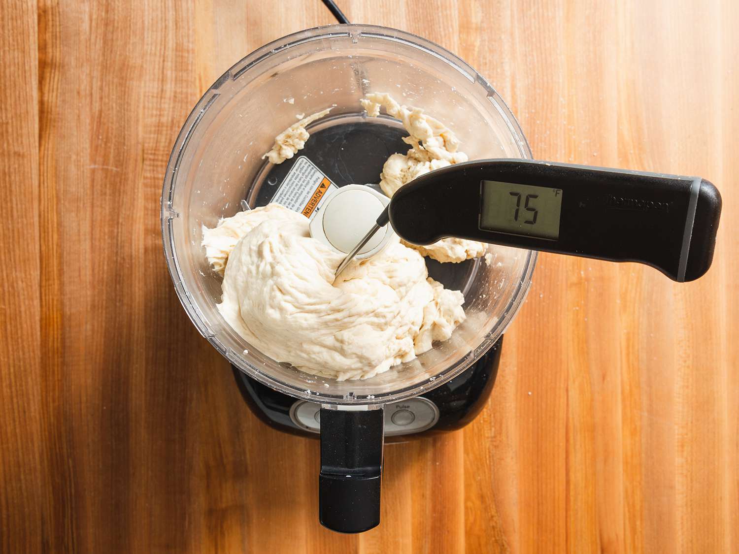 Instant read thermometer stuck in dough in food processor reading 75 degrees Fahrenheit