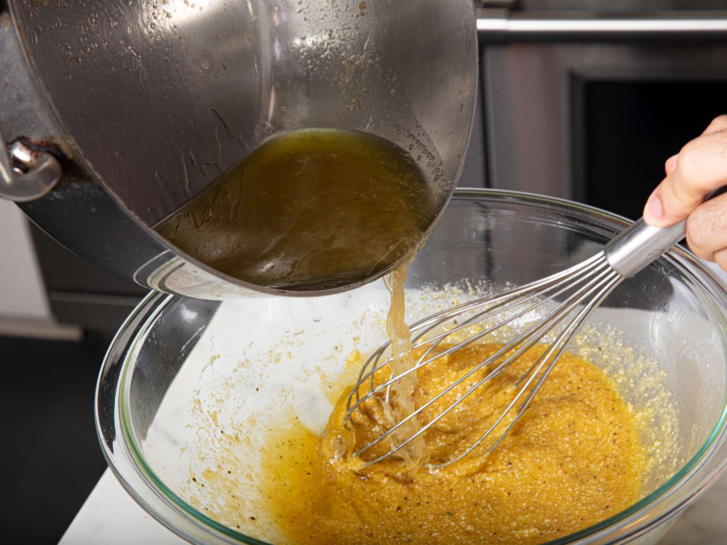 Overhead view of adding to egg mixture