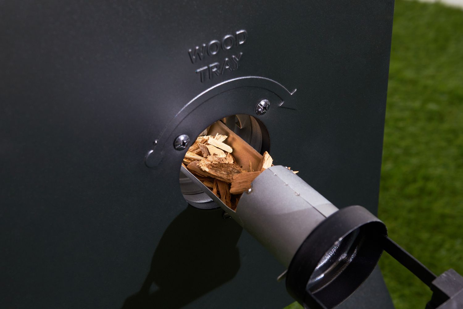 Closeup of wood chips in the wood tray of the Masterbuilt MB20072918 40-Inch Digital Electric Smoker