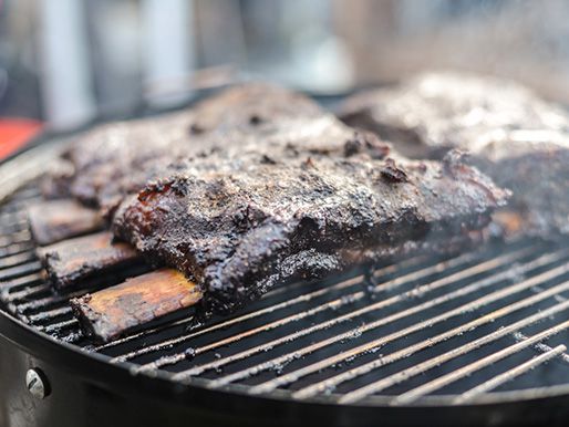 charred ribs on a grill