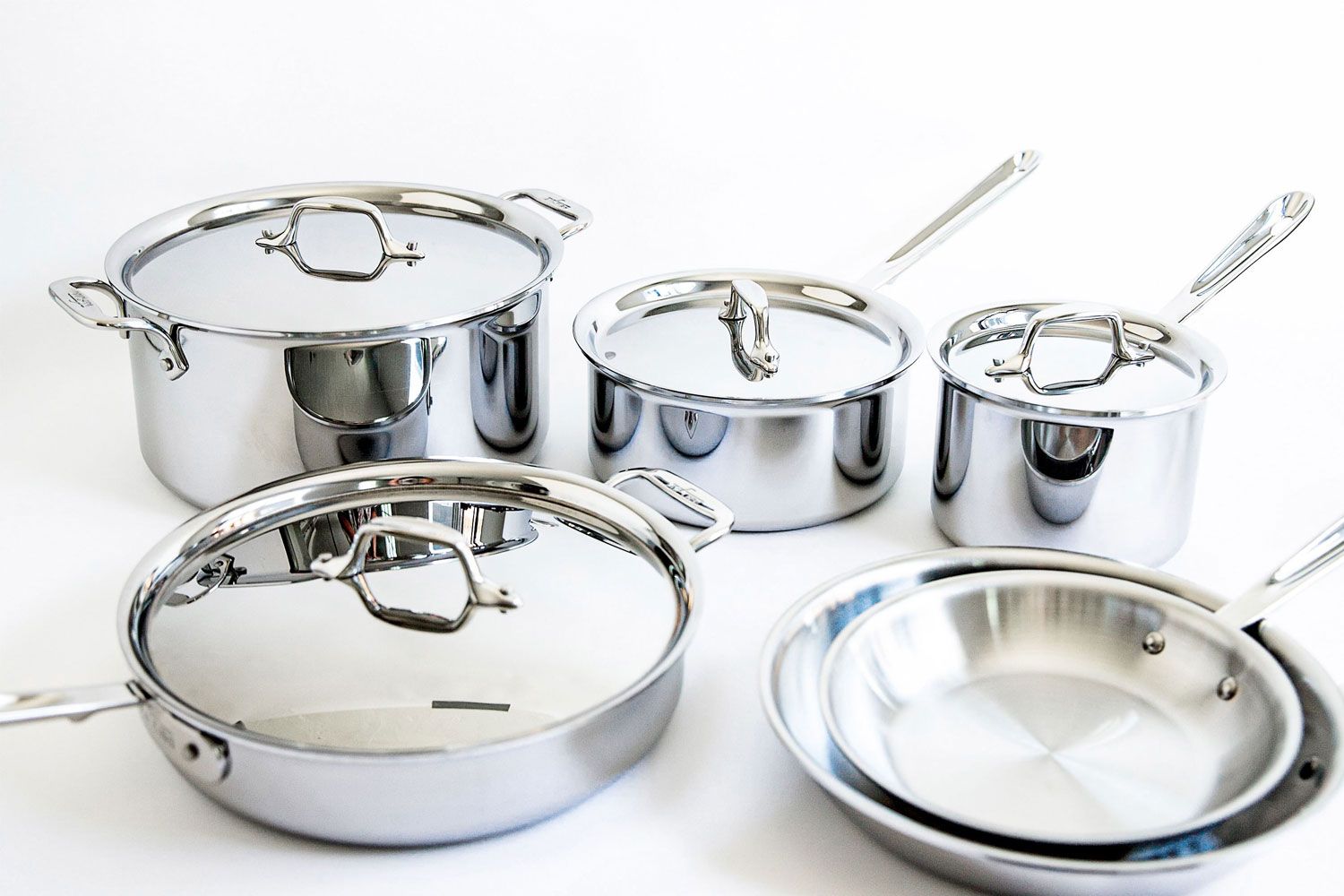 All-Clad D3 3-Ply Stainless Steel Cookware Set 10 Piece on a white surface