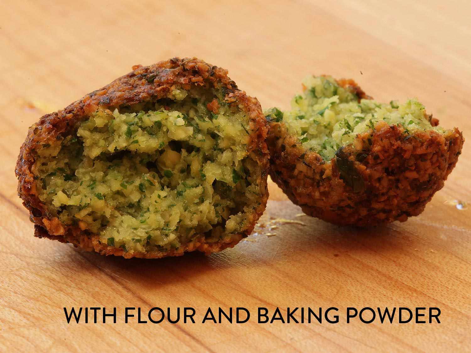 A fried falafel broken open, showing the interior. The image is labeled "with flour and baking powder."