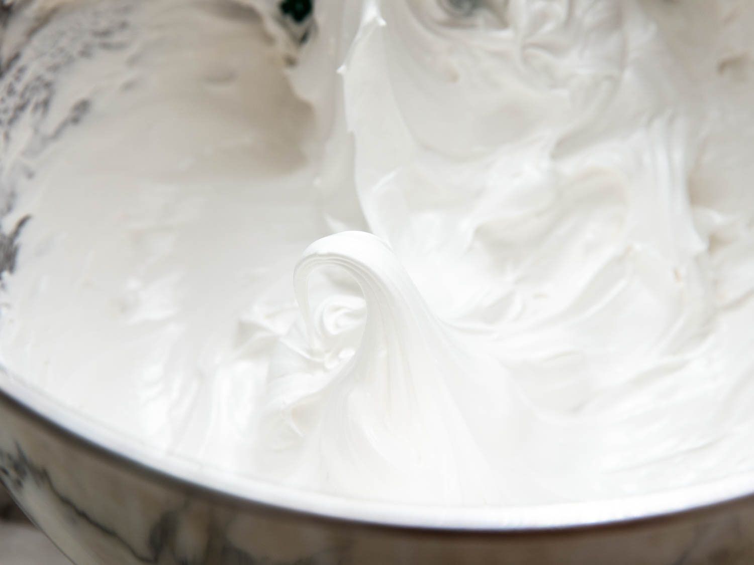 Thickly whipped meringue piled in a bowl