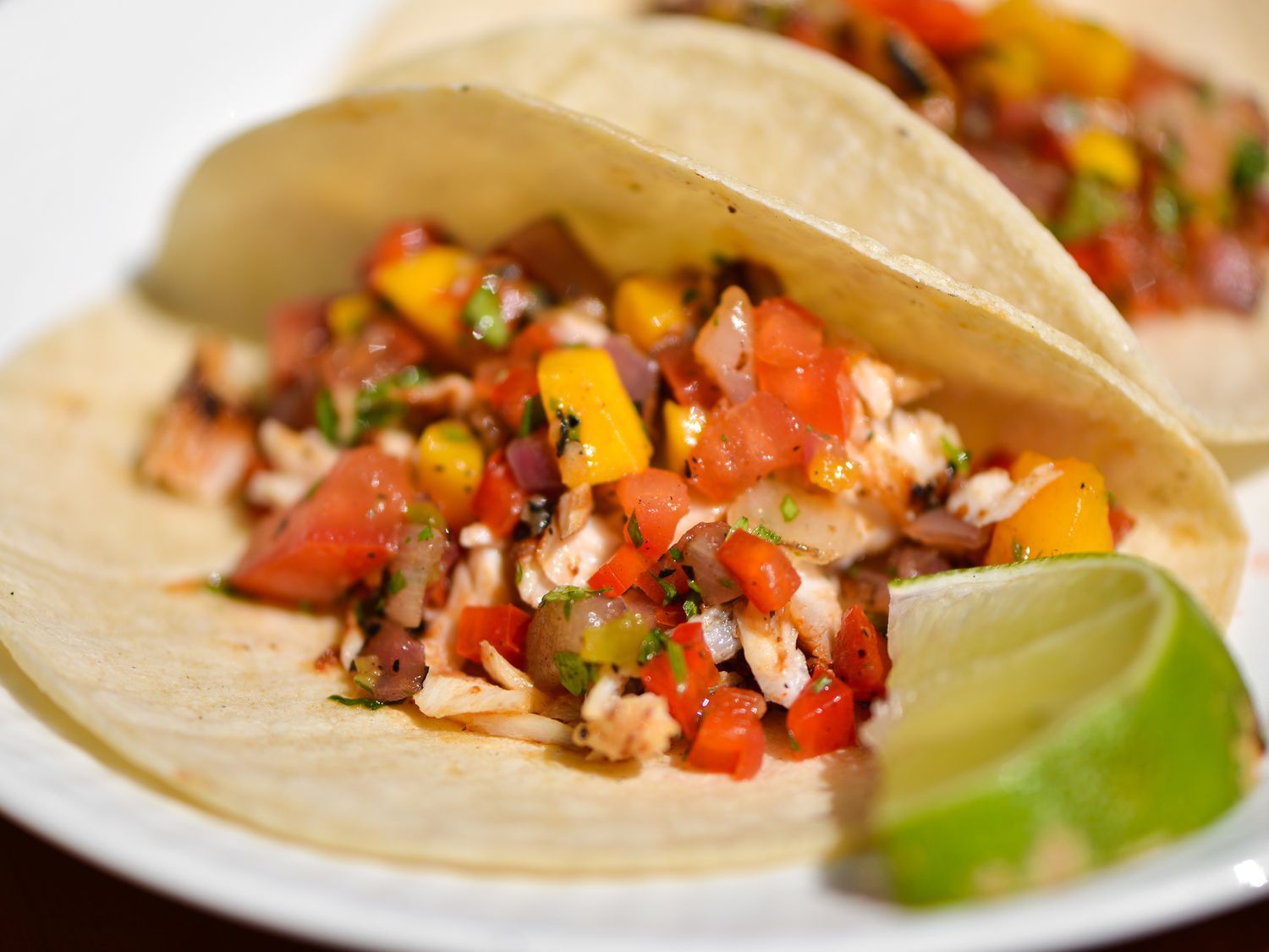 Closeup of a Chili-Rubbed Mahimahi Taco With Grilled-Mango Salsa.