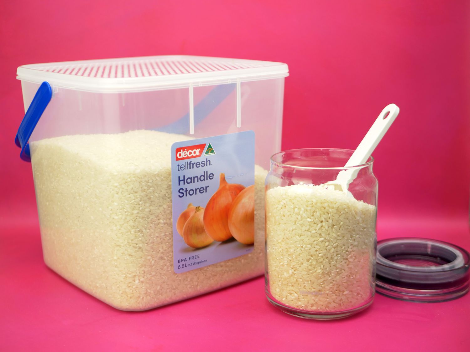 two dry food storage containers with rice inside them