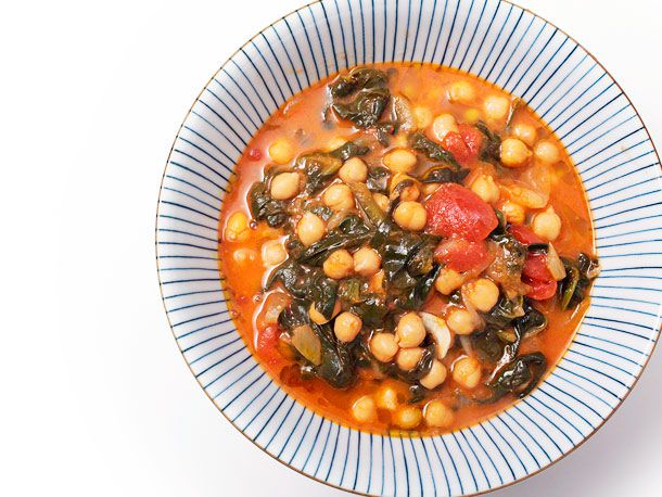 Overhead shot of a bowl of vegan Spanish Chickpea and Spinach Stew With Ginger.