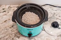 IMUSA 1.5 Quart Slow Cooker having beans placed inside