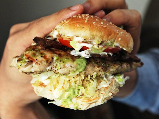 Author holds the assembled sandwich with both hands in front of the camera.