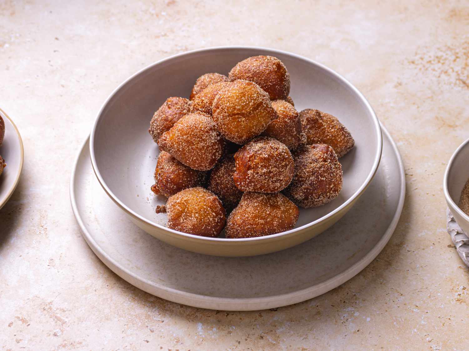 Side angle view of puff puff in a bowl