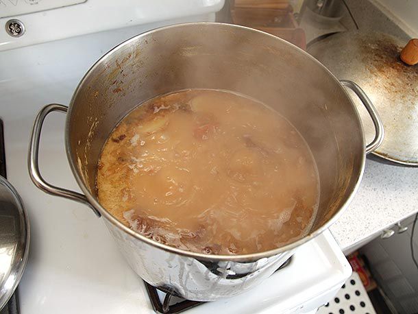 Turkey stock boiling in a stockpot. 