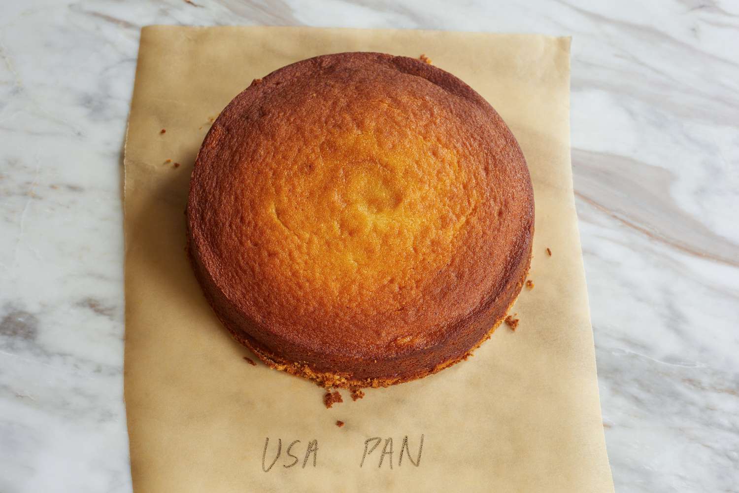 A cake layer on a marble surface