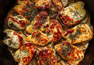 Cooked potato and halloumi gratin with herbs viewed from above
