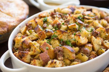 A white casserole dish filled with Thanksgiving bread stuffing