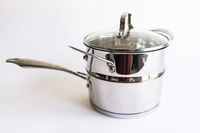 Two pots from the Cuisinart Professional Series Cookware 11 Piece Set stacked on a white surface