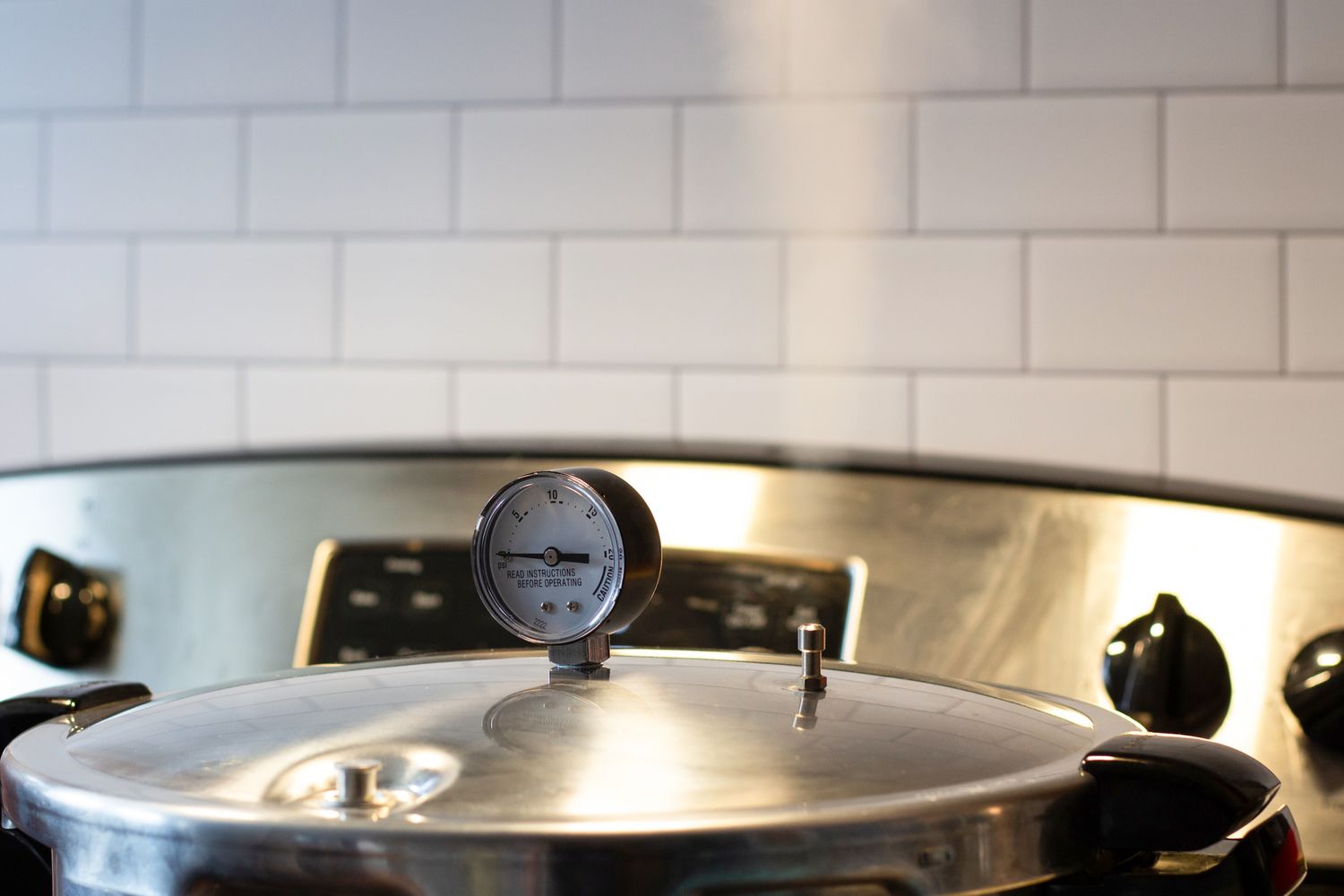 A pressure canner venting steam.