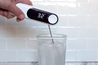 The OXO thermometer being used to take the temperature of ice water.