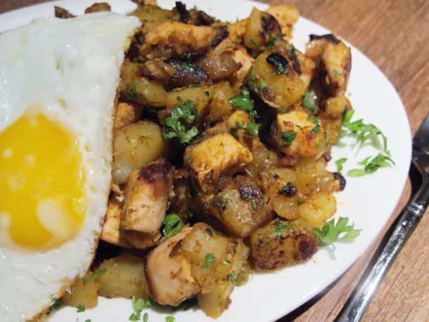 Chicken and potato hash with a fried egg.