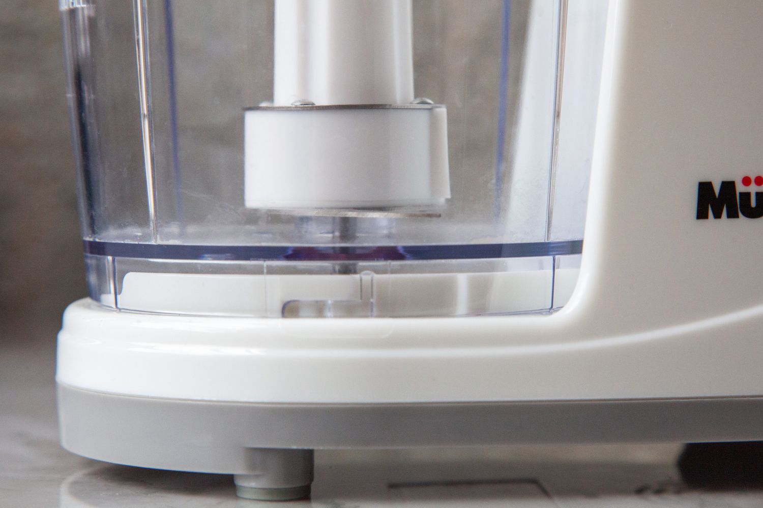 The blade of a mini food processor.