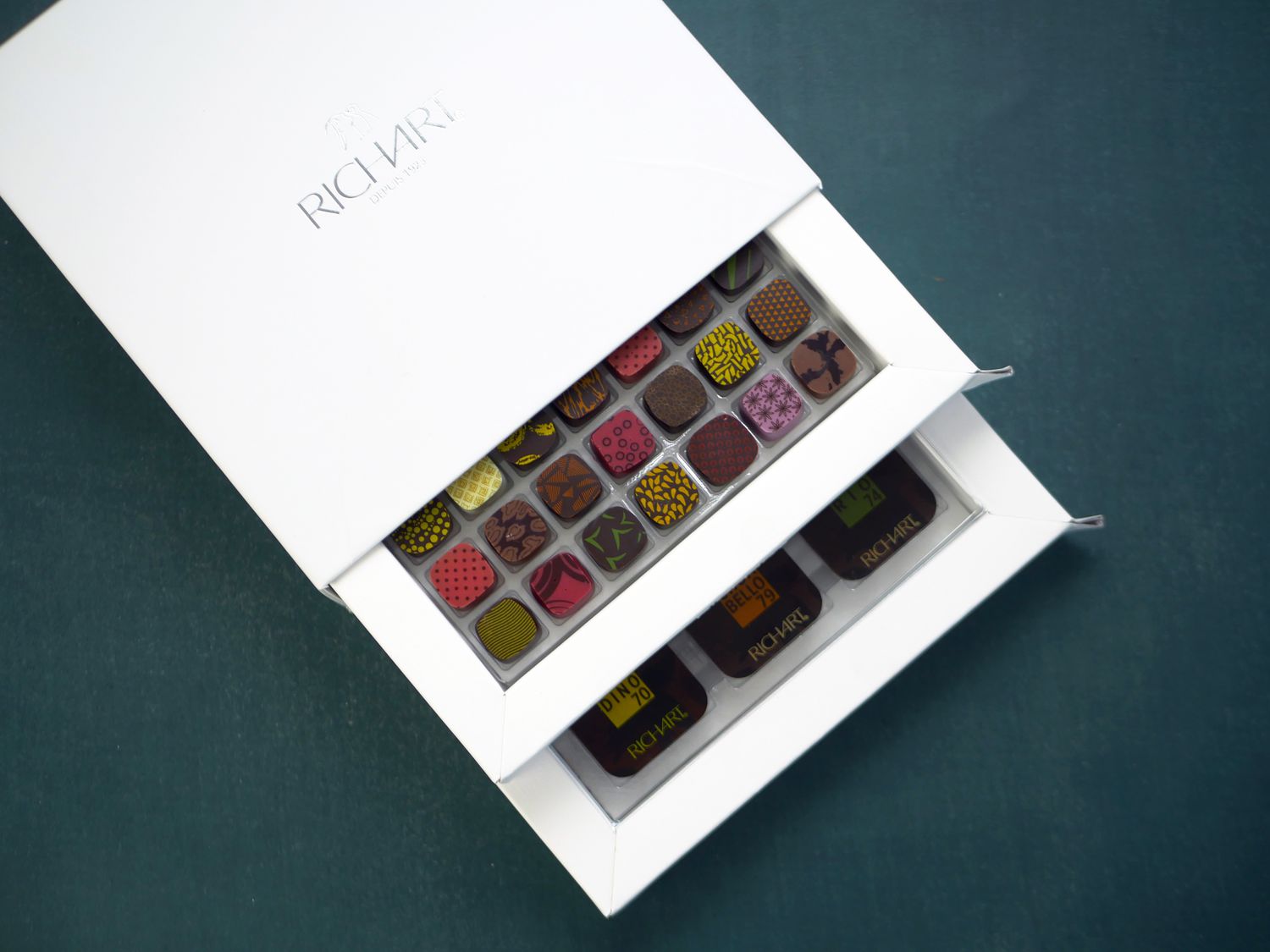 richart chocolates with two drawers pulled out to see chocolates