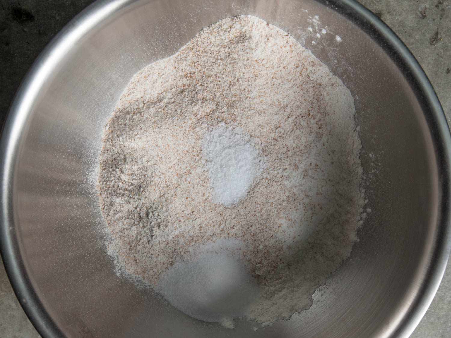 Dry ingredients for the pie dough in a mixing bowl.