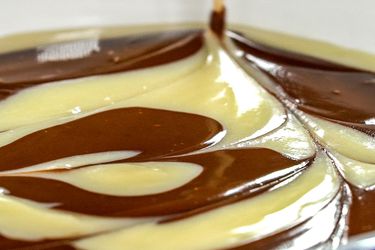 Marbled swirls of white and dark chocolate ganache