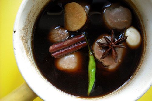 Turkey gizzards in a pot with water, soy sauce, and other ingredients for a Chinese red braise. 