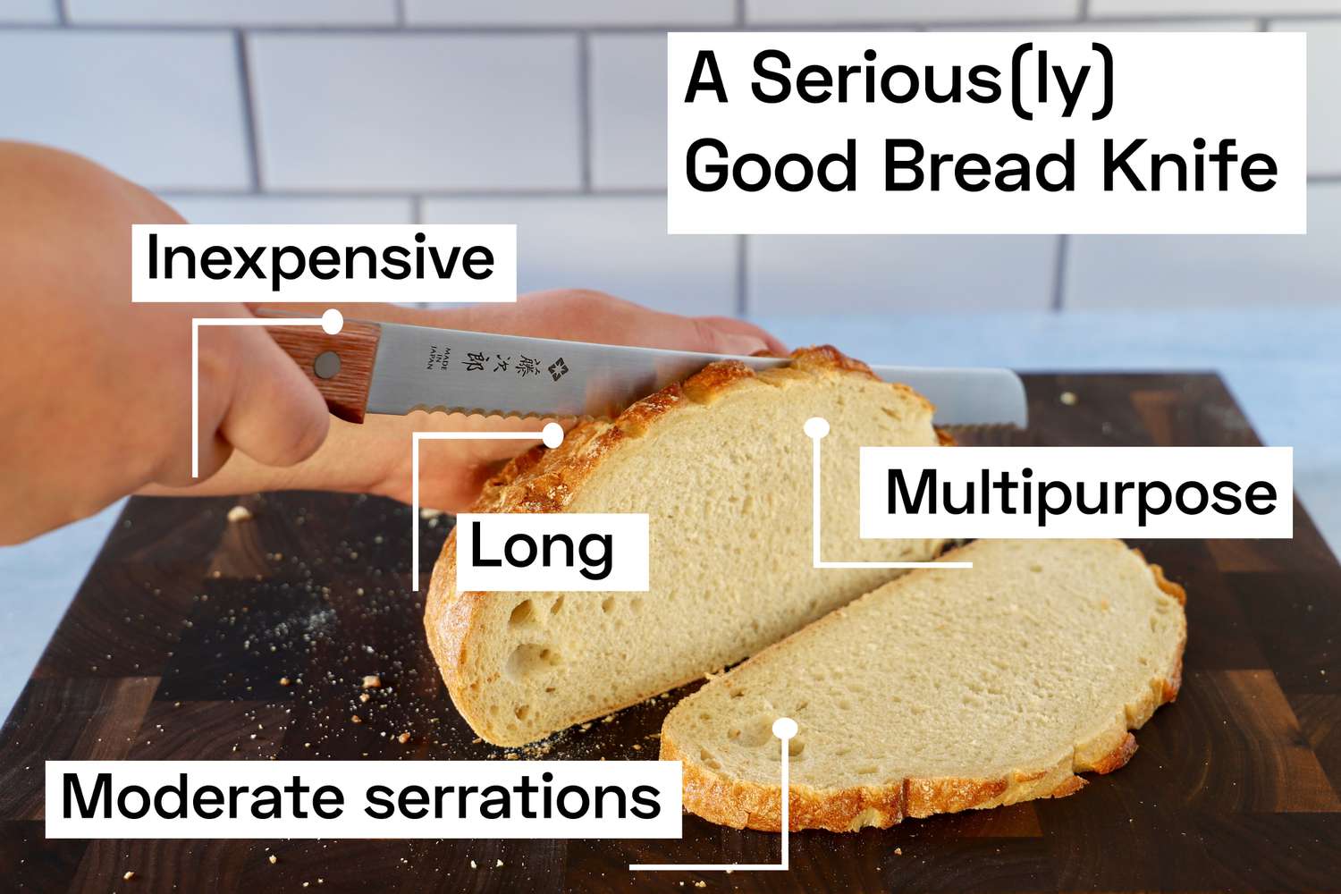 Person slicing a round loaf with a Tojiro Bread Knife