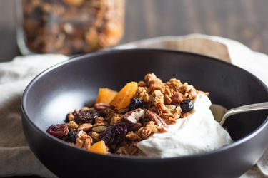 A bowl of light and crisp homemade granola served with yogurt. 