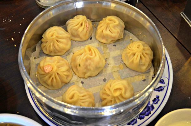 Xiao long bao, served in a stainless steel steamer.