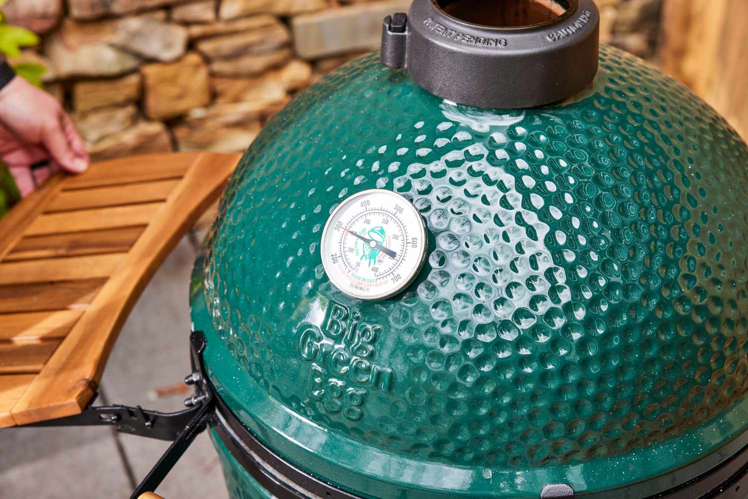 A closeup of the temperature gauge on the Big Green Egg Large Charcoal Kamado Grill and Smoker