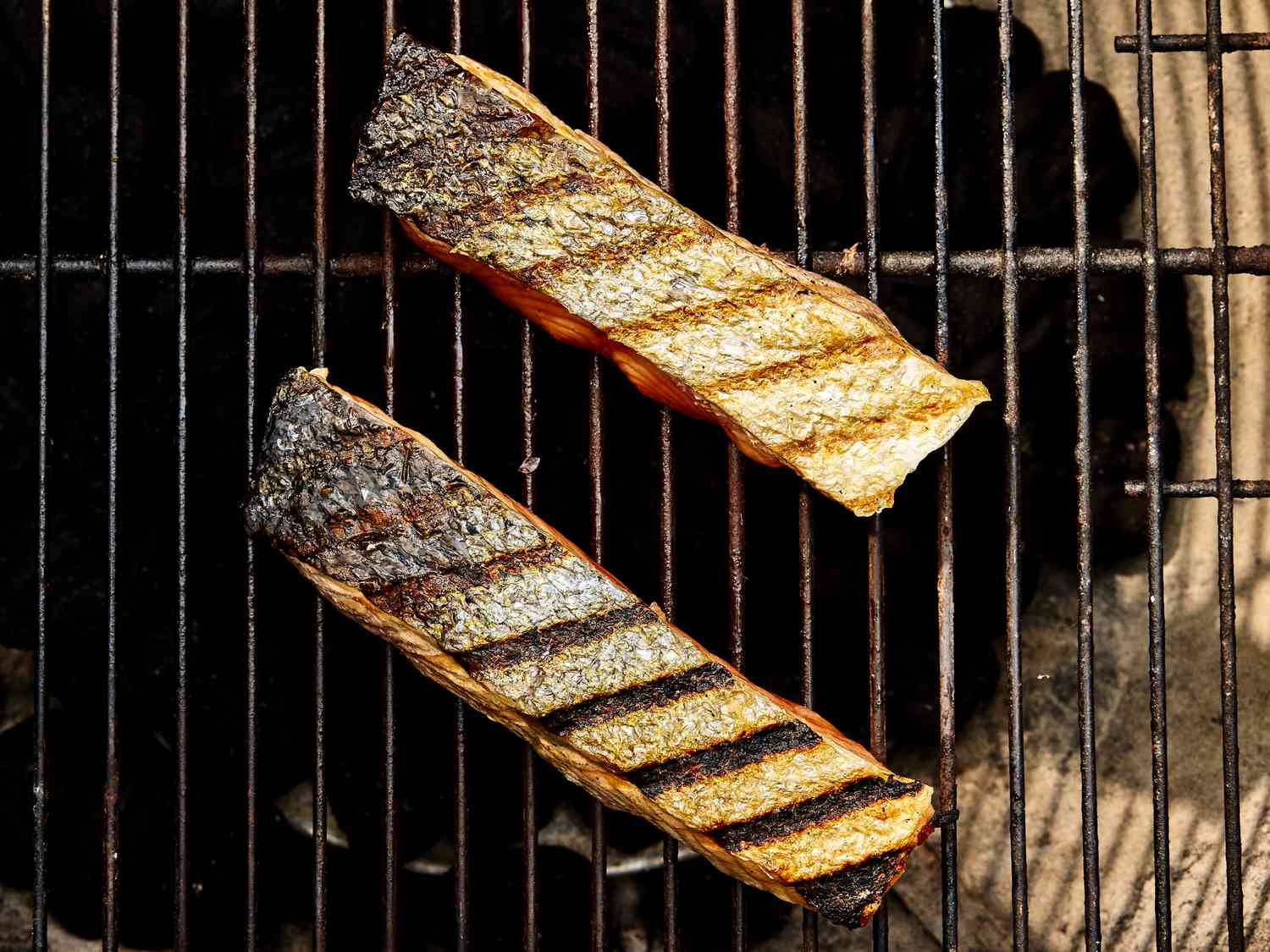 Overhead view of salmon cooked flesh side down