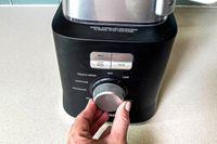 A person adjusting the presets on the Calphalon Precision blender