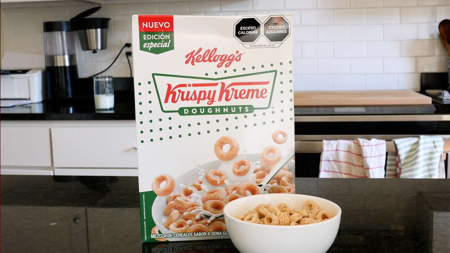Box of Krispy Kreme cereal next to a bowl of the cereal 