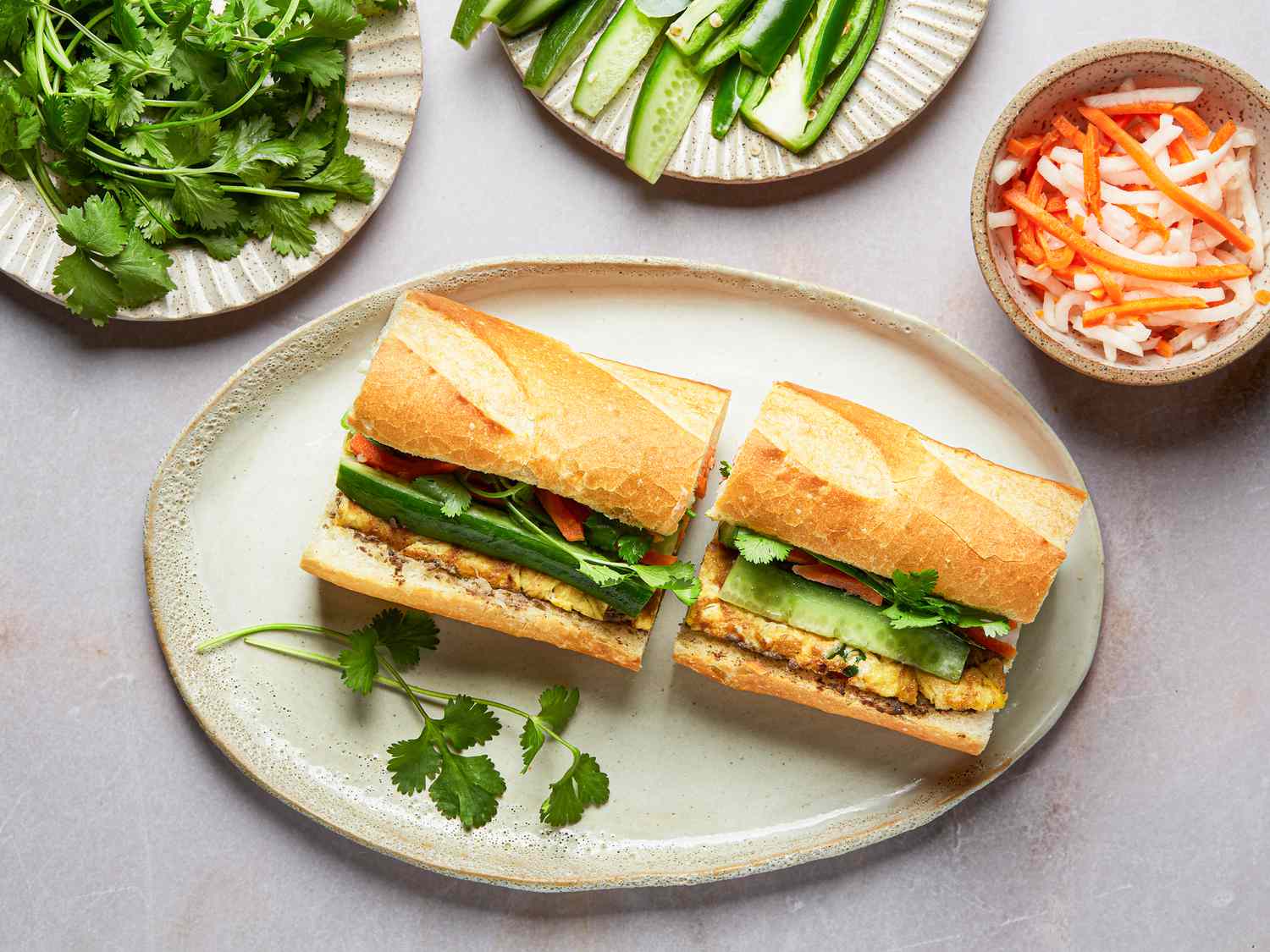 Overhead of egg and pate banh mi cut in two