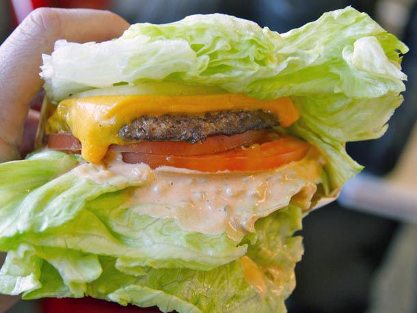 A Protein style In-N-Out burger that replaces the bun with large pieces of lettuce