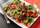 Chinese pepper steak, served on a rectangular platter.